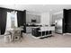 Open-concept kitchen with stainless steel appliances, granite countertops, and a breakfast bar with seating at 429 Ohio Way, Kissimmee, FL 34759