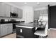 Modern kitchen with granite countertops, stainless steel appliances, and a breakfast bar with seating at 429 Ohio Way, Kissimmee, FL 34759