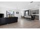 Open-concept living room, dining and kitchen area featuring tile floors and neutral paint at 429 Ohio Way, Kissimmee, FL 34759