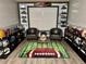 A themed bonus room with sports memorabilia and comfortable seating at 4565 Old Colony Rd, Mulberry, FL 33860