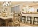 Inviting dining room with rustic wood furniture, decorative accents, and a view into the kitchen at 4565 Old Colony Rd, Mulberry, FL 33860