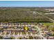 Aerial view of a residential neighborhood with green spaces, highlighting community and location at 4605 Kalispell Rd, Kissimmee, FL 34758