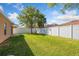 A generously sized backyard with lush green grass, providing ample space for leisure and recreation at 4605 Kalispell Rd, Kissimmee, FL 34758
