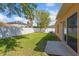 Spacious backyard with a well-maintained lawn and a privacy fence perfect for outdoor activities at 4605 Kalispell Rd, Kissimmee, FL 34758