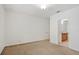 Cozy bedroom with carpeted floors and view into the en-suite bathroom at 4605 Kalispell Rd, Kissimmee, FL 34758