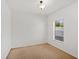 This bedroom has neutral carpet, white walls, and a window offering lots of natural light at 4605 Kalispell Rd, Kissimmee, FL 34758