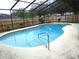 Enjoy a private screened pool area surrounded by a fence, perfect for outdoor recreation and relaxation at 4790 Point Look Out Rd, Orlando, FL 32808