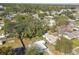 The aerial view captures the property's location within a tree-lined neighborhood, highlighting its privacy and setting at 4900 Kempston Dr, Orlando, FL 32812