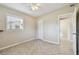 Bedroom with tile flooring, closet, updated windows, and an open door to another room at 4900 Kempston Dr, Orlando, FL 32812