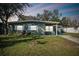 Charming single-story home featuring a well-maintained lawn and inviting curb appeal at 4900 Kempston Dr, Orlando, FL 32812