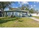Well-maintained single-story home featuring a lush lawn and inviting curb appeal at 4900 Kempston Dr, Orlando, FL 32812