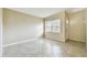 Bright and airy living room featuring neutral colors and tile flooring at 4900 Kempston Dr, Orlando, FL 32812