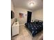 Comfortable bedroom with a decorated queen bed and dresser with TV at 5356 Oakbourne Ave, Davenport, FL 33837