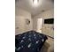 Clean bedroom with a queen bed, TV, and ensuite bathroom at 5356 Oakbourne Ave, Davenport, FL 33837
