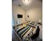 Bedroom showcases twin beds with playful Minion-themed decor and a mounted TV at 5356 Oakbourne Ave, Davenport, FL 33837