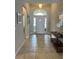 Inviting foyer with tiled floors and an arched doorway leading to other areas of the home at 5356 Oakbourne Ave, Davenport, FL 33837