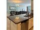 Kitchen area featuring granite countertops, a double sink, and stainless steel appliances at 5356 Oakbourne Ave, Davenport, FL 33837