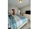 Spacious main bedroom with tile flooring, ensuite bathroom, and television at 5356 Oakbourne Ave, Davenport, FL 33837