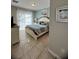 Relaxing main bedroom featuring a king bed and bright, natural light at 5356 Oakbourne Ave, Davenport, FL 33837