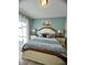 Cozy main bedroom with a king bed, nightstands, and soft, natural light at 5356 Oakbourne Ave, Davenport, FL 33837