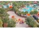 Aerial shot of the community's playground with colorful play structures and a sand pit at 5356 Oakbourne Ave, Davenport, FL 33837