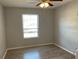 Bright bedroom with a ceiling fan, a window providing natural light, and laminate flooring throughout at 586 Brantley Terrace Way # 201, Altamonte Springs, FL 32714