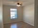 Bright bedroom with wood floors and ceiling fan at 586 Brantley Terrace Way # 201, Altamonte Springs, FL 32714