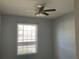 Bright bedroom with a ceiling fan, a window providing natural light at 586 Brantley Terrace Way # 201, Altamonte Springs, FL 32714