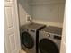 Modern laundry room featuring a front-load washer and dryer, offering convenience and efficiency at 586 Brantley Terrace Way # 201, Altamonte Springs, FL 32714