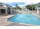 Community pool featuring sparkling blue water, lounge chairs, and shaded cabana areas at 586 Brantley Terrace Way # 201, Altamonte Springs, FL 32714