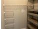 Spacious walk-in closet with ample shelving and storage, maximizing organization and convenience at 586 Brantley Terrace Way # 201, Altamonte Springs, FL 32714