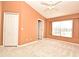 Bright bedroom with large window, closet, and plush carpeting for comfort at 660 Captiva Cir, Kissimmee, FL 34741