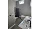 Modern bathroom featuring double vanity, soaking tub, walk-in shower with black accents, and natural lighting at 703 Pine Shores Cir, New Smyrna Beach, FL 32168
