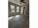 Spacious bedroom with large tile flooring, ceiling fan and a double door closet at 703 Pine Shores Cir, New Smyrna Beach, FL 32168