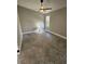 Cozy bedroom with neutral walls, tile flooring, a ceiling fan and a window allowing natural light at 703 Pine Shores Cir, New Smyrna Beach, FL 32168