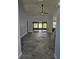 Spacious living room with tile floors, ceiling fan, and sliding glass doors leading to the outdoors at 703 Pine Shores Cir, New Smyrna Beach, FL 32168