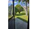 A beautiful view of the landscaped backyard with a pond at 703 Pine Shores Cir, New Smyrna Beach, FL 32168