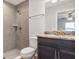 Modern bathroom with granite countertops, tiled shower, and a vanity at 7139 Se 122Nd Ln, Belleview, FL 34420