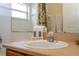 Close-up of bathroom vanity with sink and essential toiletries at 8095 Indian Creek Blvd, Kissimmee, FL 34747