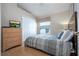 Comfortable bedroom with laminate wood floors and a spacious closet at 8095 Indian Creek Blvd, Kissimmee, FL 34747