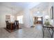 Open-concept dining room leading into the front entry and eat-in kitchen at 8095 Indian Creek Blvd, Kissimmee, FL 34747