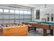 The garage features a foosball table and pool table for entertainment at 8095 Indian Creek Blvd, Kissimmee, FL 34747