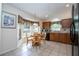 Charming eat-in kitchen features tile flooring, black appliances, and abundant natural light at 8095 Indian Creek Blvd, Kissimmee, FL 34747