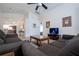 Bright living room with vaulted ceilings, tile floors, and comfortable seating area at 8095 Indian Creek Blvd, Kissimmee, FL 34747