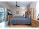 Main bedroom suite offers a serene space with neutral tones, complemented by ample natural light at 8095 Indian Creek Blvd, Kissimmee, FL 34747