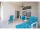 Covered patio offers seating and a ceiling fan for relaxed outdoor enjoyment at 8095 Indian Creek Blvd, Kissimmee, FL 34747