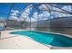 Relaxing screened-in pool with crystal clear, blue water at 8095 Indian Creek Blvd, Kissimmee, FL 34747
