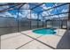 A screened-in pool area offers a refreshing retreat at 8095 Indian Creek Blvd, Kissimmee, FL 34747