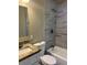 Updated bathroom features modern tile, a new vanity, and a shower-tub combination at 905 Governors Ave, Orlando, FL 32808