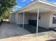 Wide carport featuring a concrete floor and parking for multiple cars at 905 Governors Ave, Orlando, FL 32808